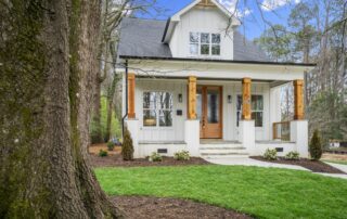 Tree with house behind it | BQuest Homes